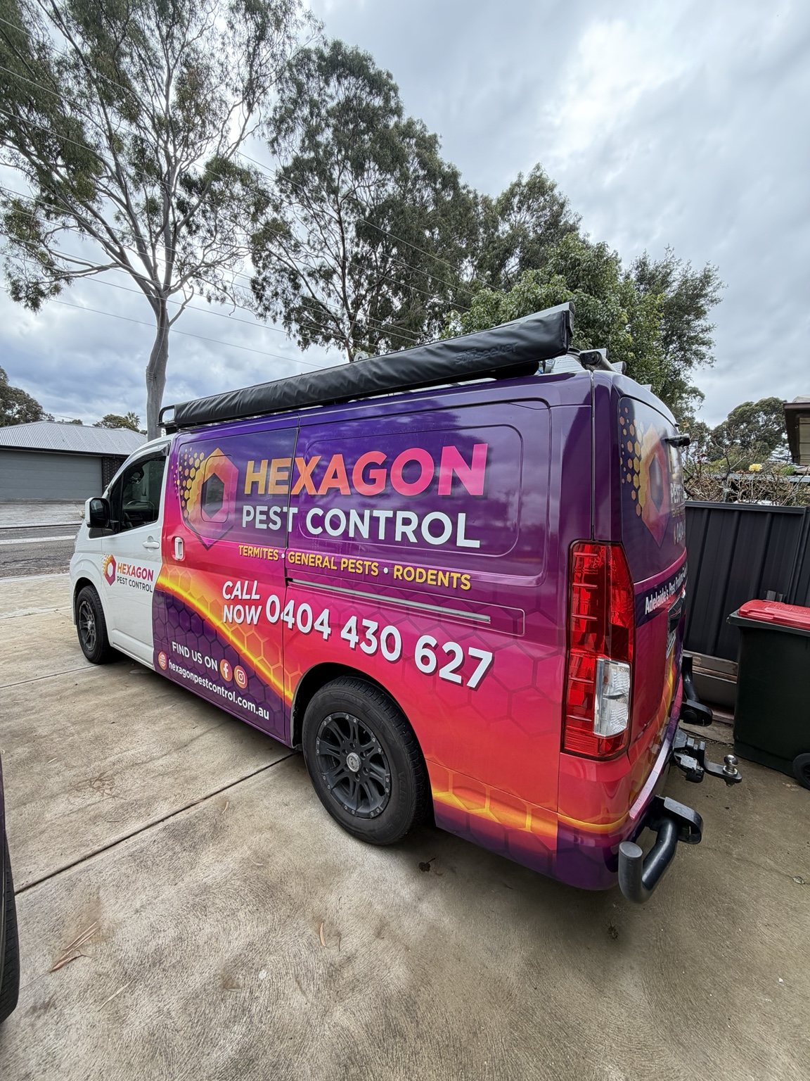Rear angle view of Hexagon Pest Control van